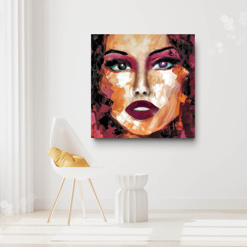 Abstract painting of a woman's face on a white wall with a chair and vase in the foreground.