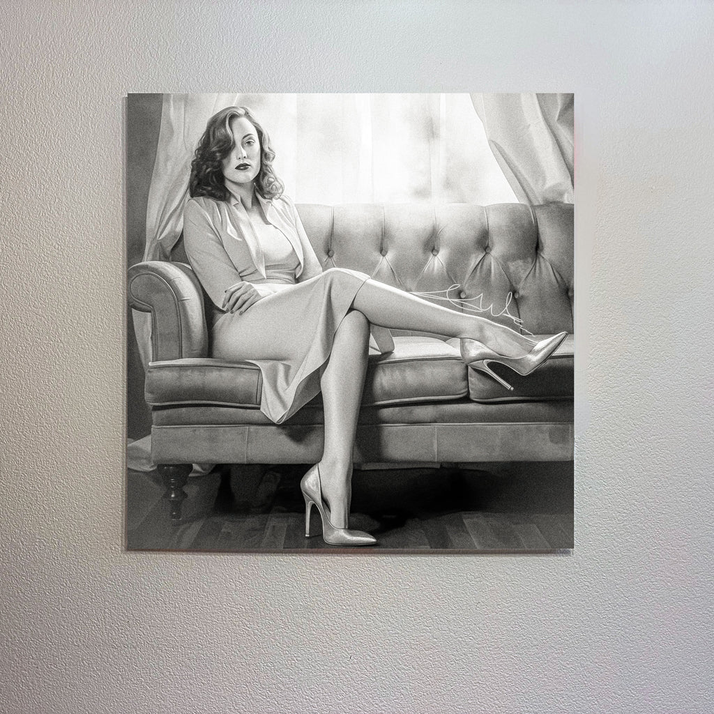 Woman in a dress sitting on a couch with high heels displayed on a wall.