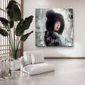 Modern living room with a white sofa, potted plant, and a large abstract painting on the wall.