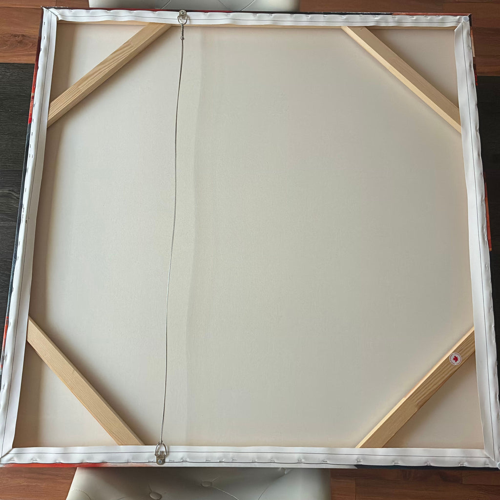 Blank canvas with wooden frame on a wooden surface