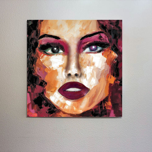Abstract painting of a woman's face on a wall