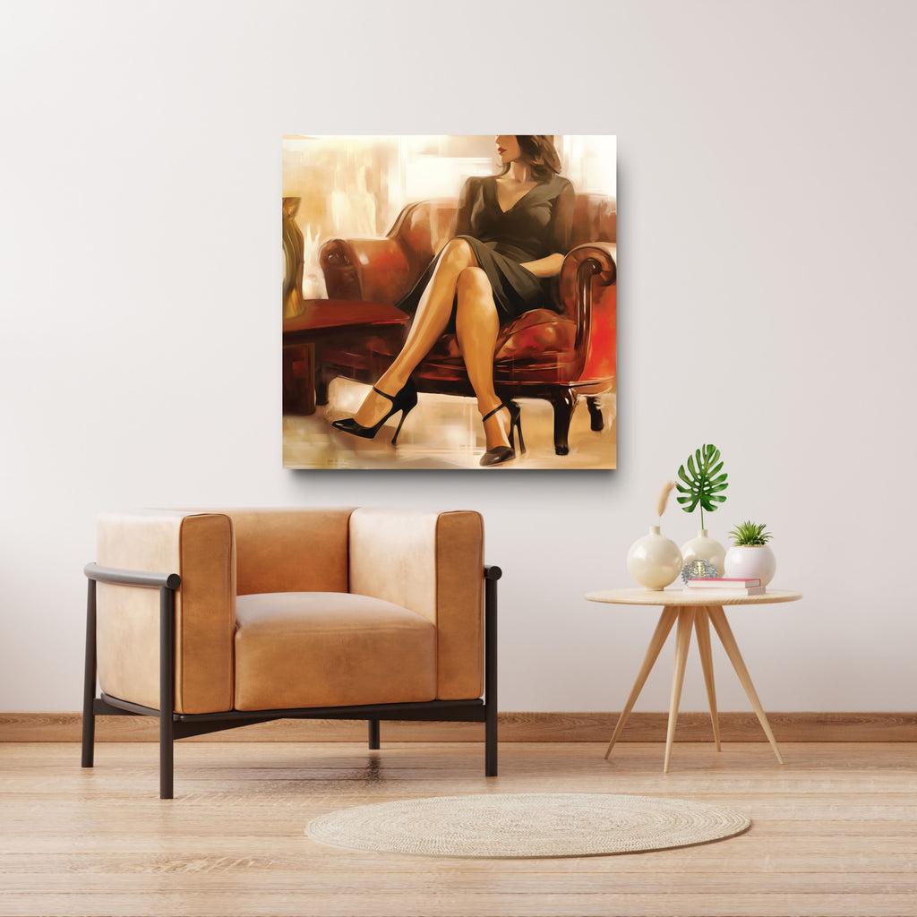 Modern living room with a tan armchair, small round table, and wall art of a woman on a couch.